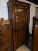 A good carved oak hall cupboard