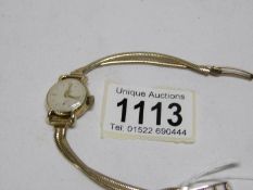 A ladies 9ct gold Tudor Rolex wrist watch