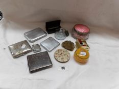 4 cigarette cases, a lighter, a powder bowl,