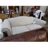 A floral Chesterfield style sofa