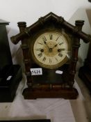 A German made mantel clock with bamboo effect door