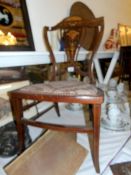 An Edwardian inlaid mahogany chair