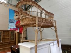 A wicker crib on stand