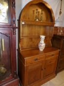 A small oak arched top dresser