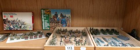 A collection of various metal and plastic wargaming figures