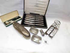 A silver toast rack, pair of silver salts,