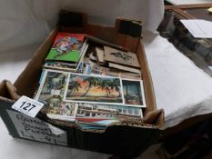 A box of assorted postcards