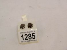 A large pair of garnet stud earrings set in silver circa 1960/70's