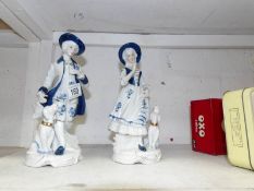 A pair of blue and white figures