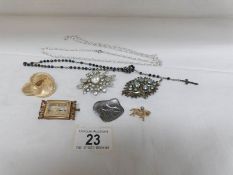 2 necklaces and 5 brooches