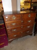 A 2 over 3 oak chest of drawers