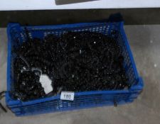 A box of black glass chandelier beads