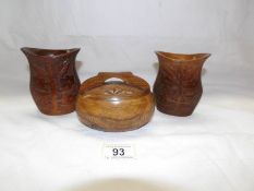 A pair of carved wood vases and one other item