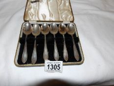 A cased set of silver spoons,