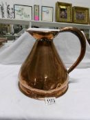 A Victorian copper ale jug