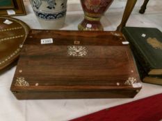 A Rosewood veneered writing slope with mother of pearl inlay