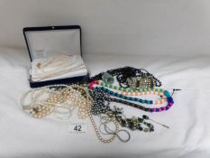 A quantity of necklaces including pearls with silver clasp