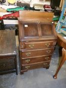 A small oak bureau with fall front and 4 drawers