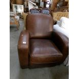 A brown leather arm chair