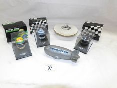 3 miniature Grand Prix helmets,