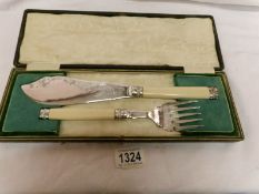 A cased pair of fish servers