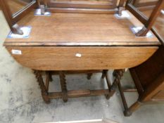 An oak barley twist gate leg table