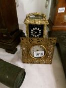 A gilded ormolu carriage clock and one other,