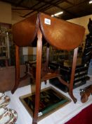 An Edwardian card table with 4 drop sides