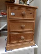 A pine 3 drawer bedside chest