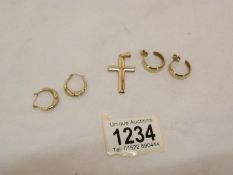 2 pairs of 9ct gold earrings and a 9ct gold cross,
