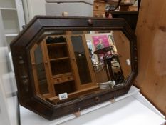 An Edwardian oak hall mirror