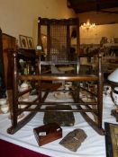 An early country rocking chair with cane seat and back