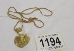 A 14ct gold elephant head pendant on chain