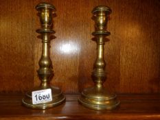 A pair of 19th century brass candlesticks made by Gervruder Bing,