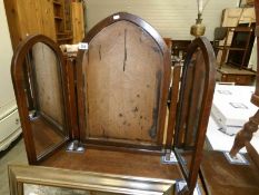 A triple dressing table mirror,