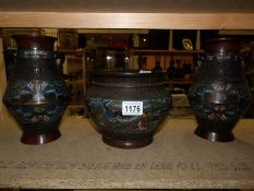 A pair of early Cloissonne vases and matching jardiniere