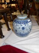 A large blue and white ginger jar