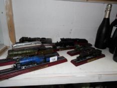 8 model railway engines on bases