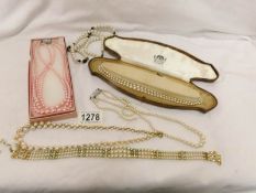 A quantity of pearl and other necklaces,