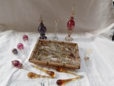 3 glass perfume bottles and a quantity of glass stoppers