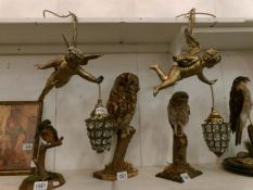 A pair of gilded cherub ceiling lights with shades