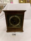 An oak cased Elliott mantel clock in working order