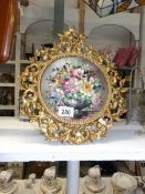 A gilt framed floral painting