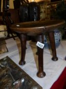 Tribal art interest, An interesting 19th century dished African carved stool/headrest, of good