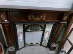 A mahogany fire surround with tiled inset