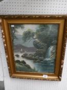 A gilt framed watercolour waterfall scene