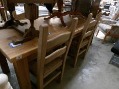 A Pine dining table and 4 chairs