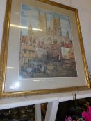 A large gilt framed print of Lincoln Cathedral