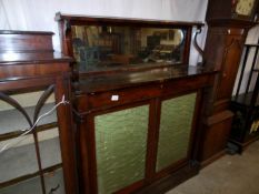 A Victorian rosewood chiffioniere with silk panelled doors