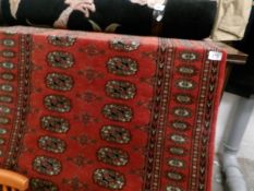 A Arabian style red rug